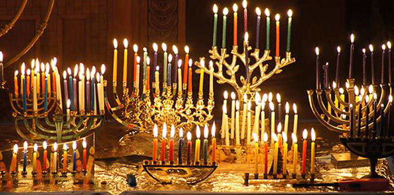 A large group of Menorah with all candles lite